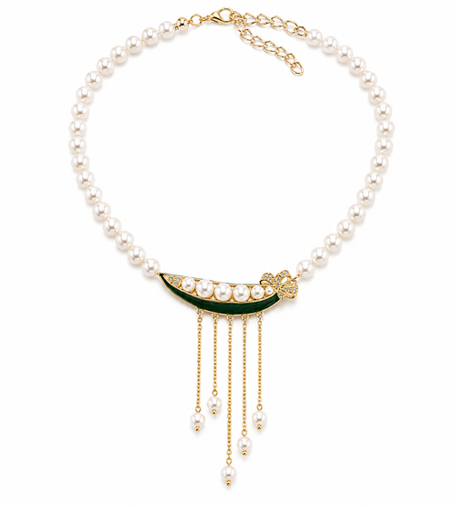 A pearl necklace with a gold crescent moon pendant decorated with green enamel and small pearls, featuring dangling gold chains with pearl beads.
