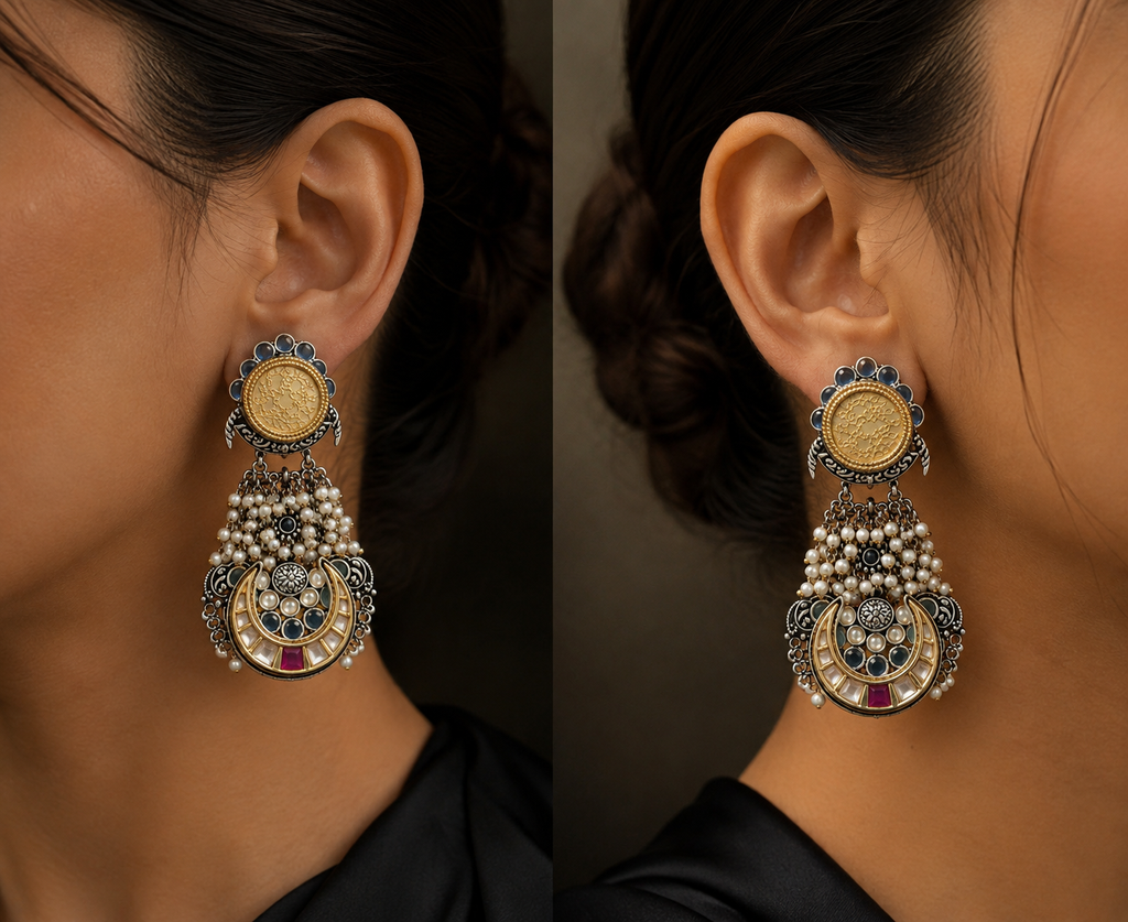 A close-up of a model wearing gold-tone crescent drop earrings with pearl clusters, shown from both sides.