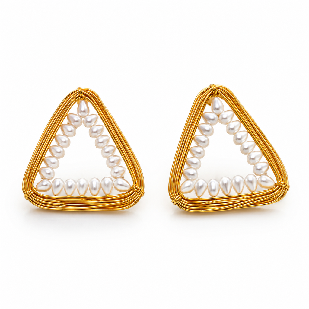 A pair of gold triangle earrings featuring a border of white freshwater pearls, set against a clean white background.