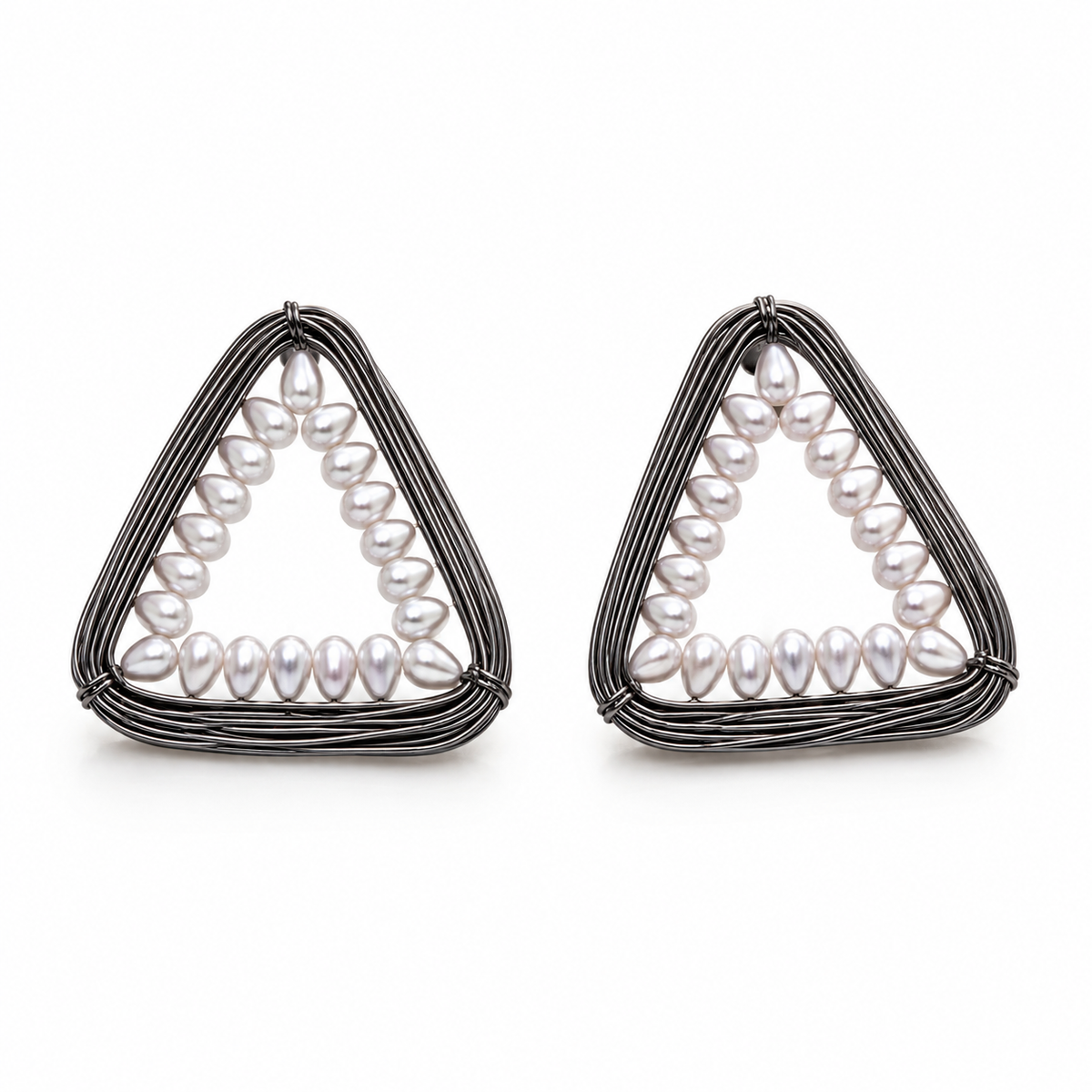 A pair of geometric triangle earrings featuring a silver-toned wire frame with a row of white baroque pearls along the inner curve, set against a plain white background.